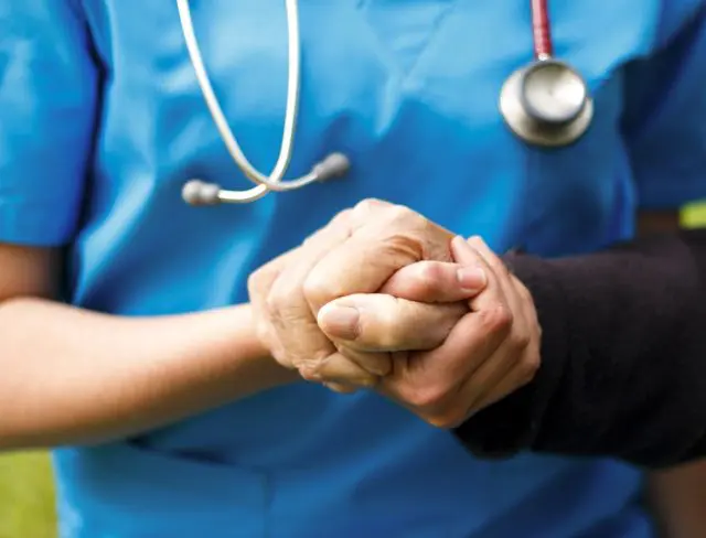 Doctor gives support to her patient